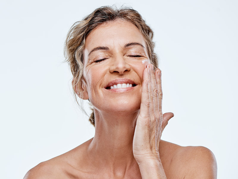 beautiful woman touching her face