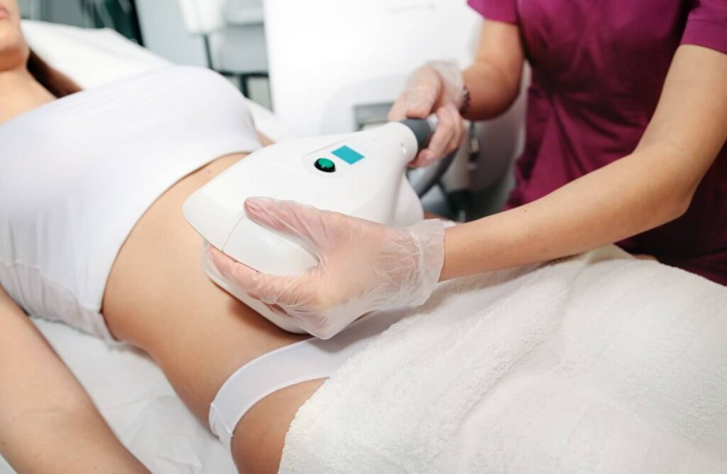 Woman receiving CoolSculpting treatment at EpiCentre Skin Care & Laser Center in Dallas