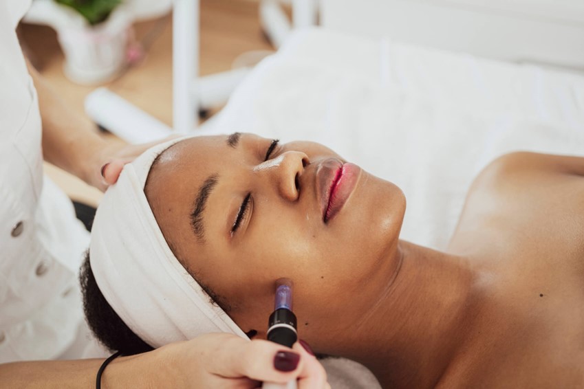 A person getting a microneedling treatment